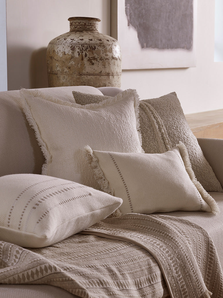 de Le Cuona | Assegai Throw with Fringe & Suede Edge – Stone