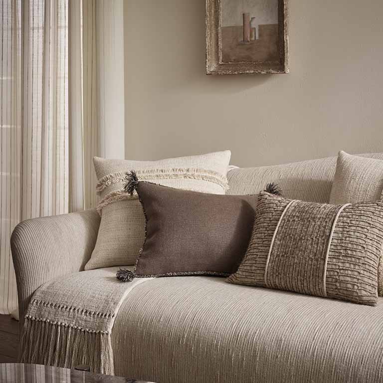 de Le Cuona | Cape Cushion with Braided Cord Trim – Taupe